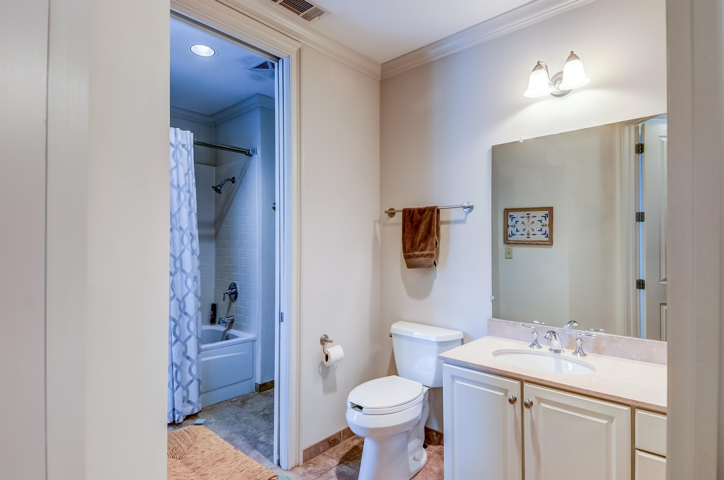 591 Lexington Road, Unit 303 Memphis, TN 38117 - Photo 22 of 34 a bathroom with a sink toilet and shower