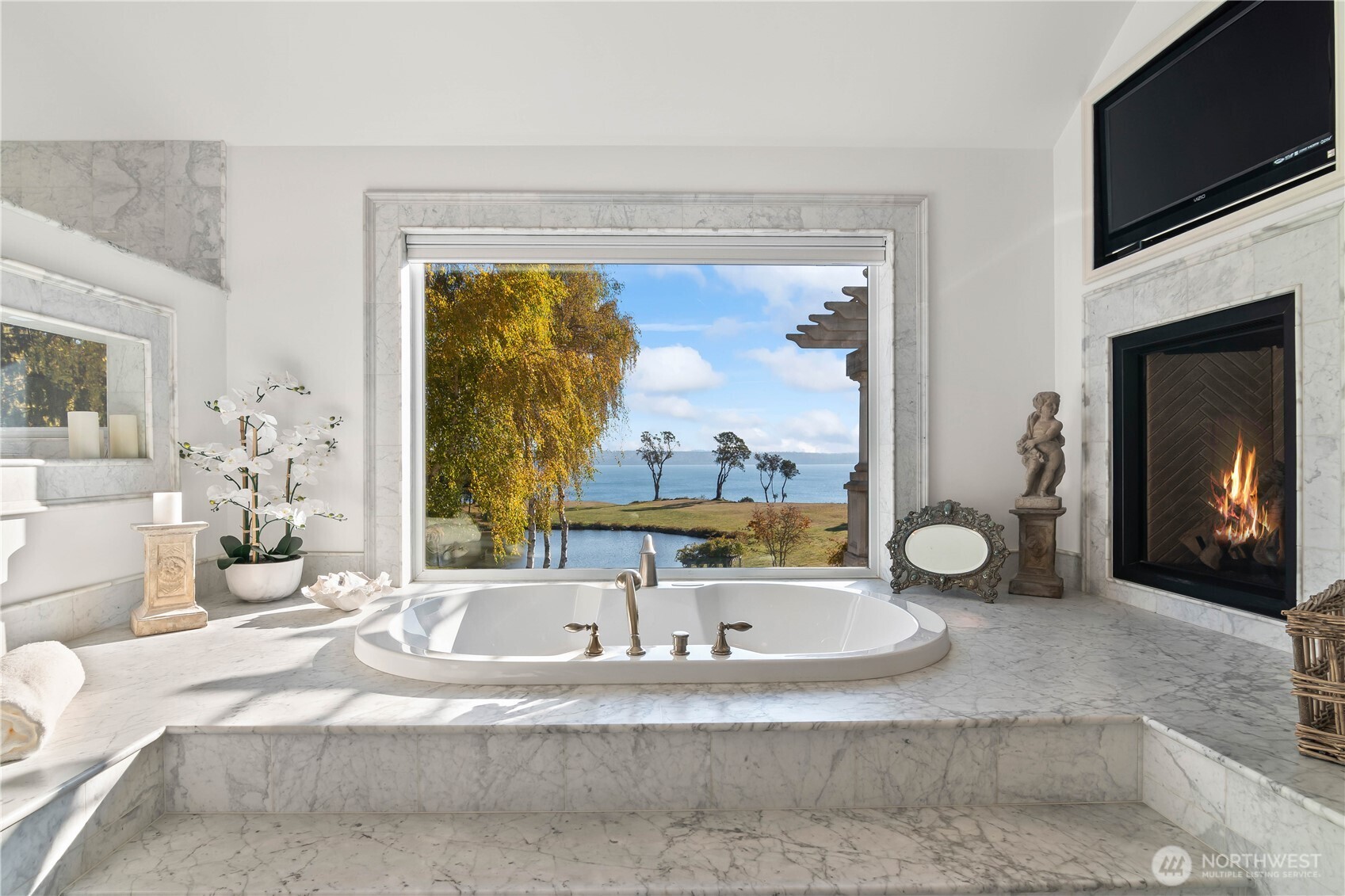 4205 Southwest Point Robinson Road Vashon, WA 98070 - Photo 17 of 40 a bathroom with a tub and a large window