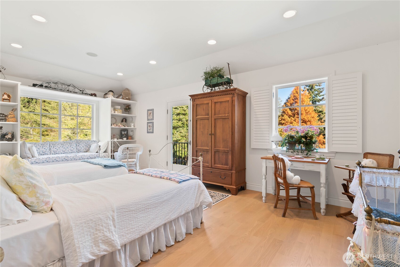 4205 Southwest Point Robinson Road Vashon, WA 98070 - Photo 20 of 40 a spacious bedroom with a bed a table and chair