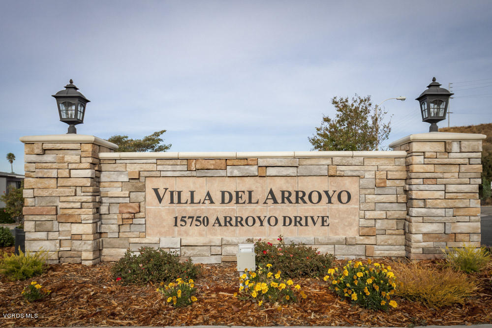 15750 Arroyo Drive, Unit 32 Moorpark, CA 93021 - Photo 2 of 26 a sign on the wall of building