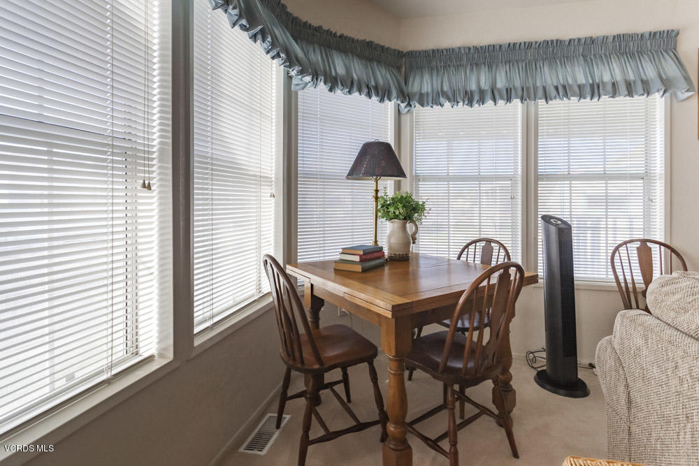 15750 Arroyo Drive, Unit 32 Moorpark, CA 93021 - Photo 11 of 26 a view of a dining room and livingroom with furniture