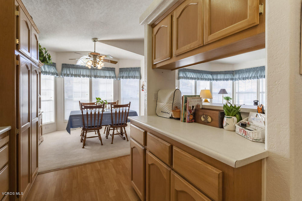 15750 Arroyo Drive, Unit 32 Moorpark, CA 93021 - Photo 14 of 26 a view of a room with furniture and a chandelier