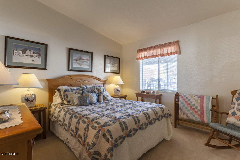 15750 Arroyo Drive, Unit 32 Moorpark, CA 93021 - Photo 18 of 26 a bedroom with a bed and window
