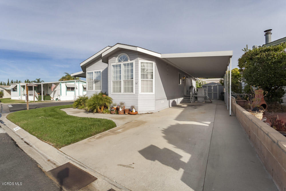 15750 Arroyo Drive, Unit 32 Moorpark, CA 93021 - Photo 23 of 26 a front view of a house with a yard