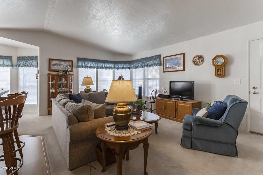 15750 Arroyo Drive, Unit 32 Moorpark, CA 93021 - Photo 6 of 26 a living room with furniture and a flat screen tv