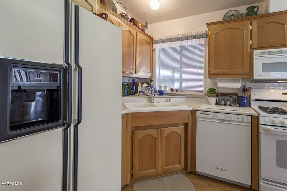 15750 Arroyo Drive, Unit 32 Moorpark, CA 93021 - Photo 9 of 26 a utility room with sink dryer and washer