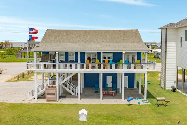 a view of houses with swimming pool