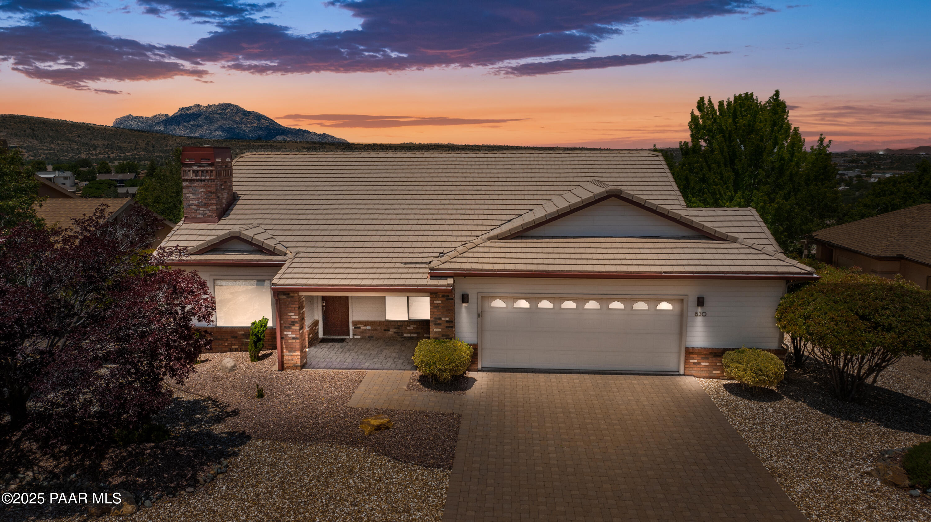 830 Hoosier Pass Prescott, AZ 86301 - Photo 1 of 41 a front view of a house with a yard and garage
