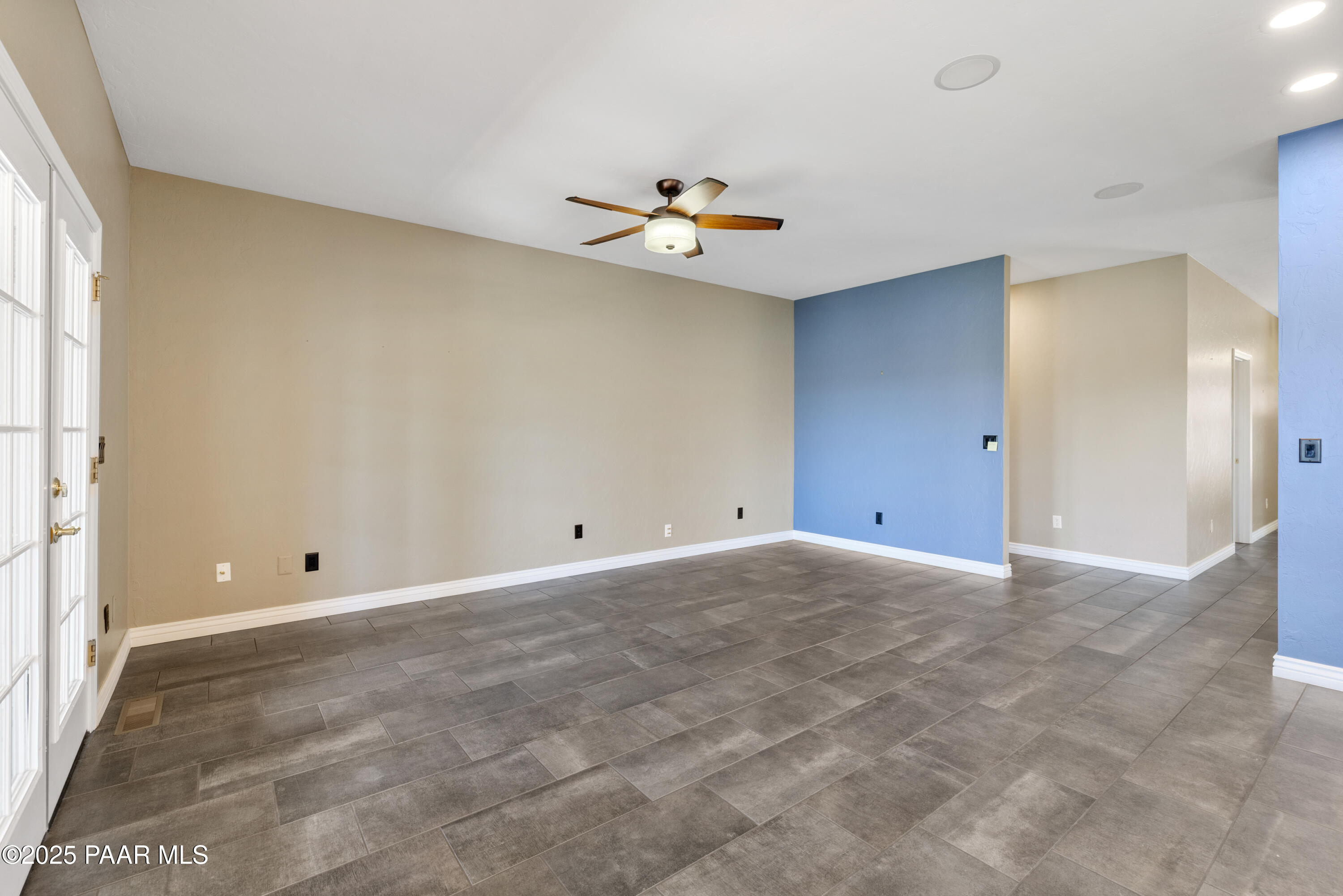 830 Hoosier Pass Prescott, AZ 86301 - Photo 14 of 41 wooden floor in an empty room with a window
