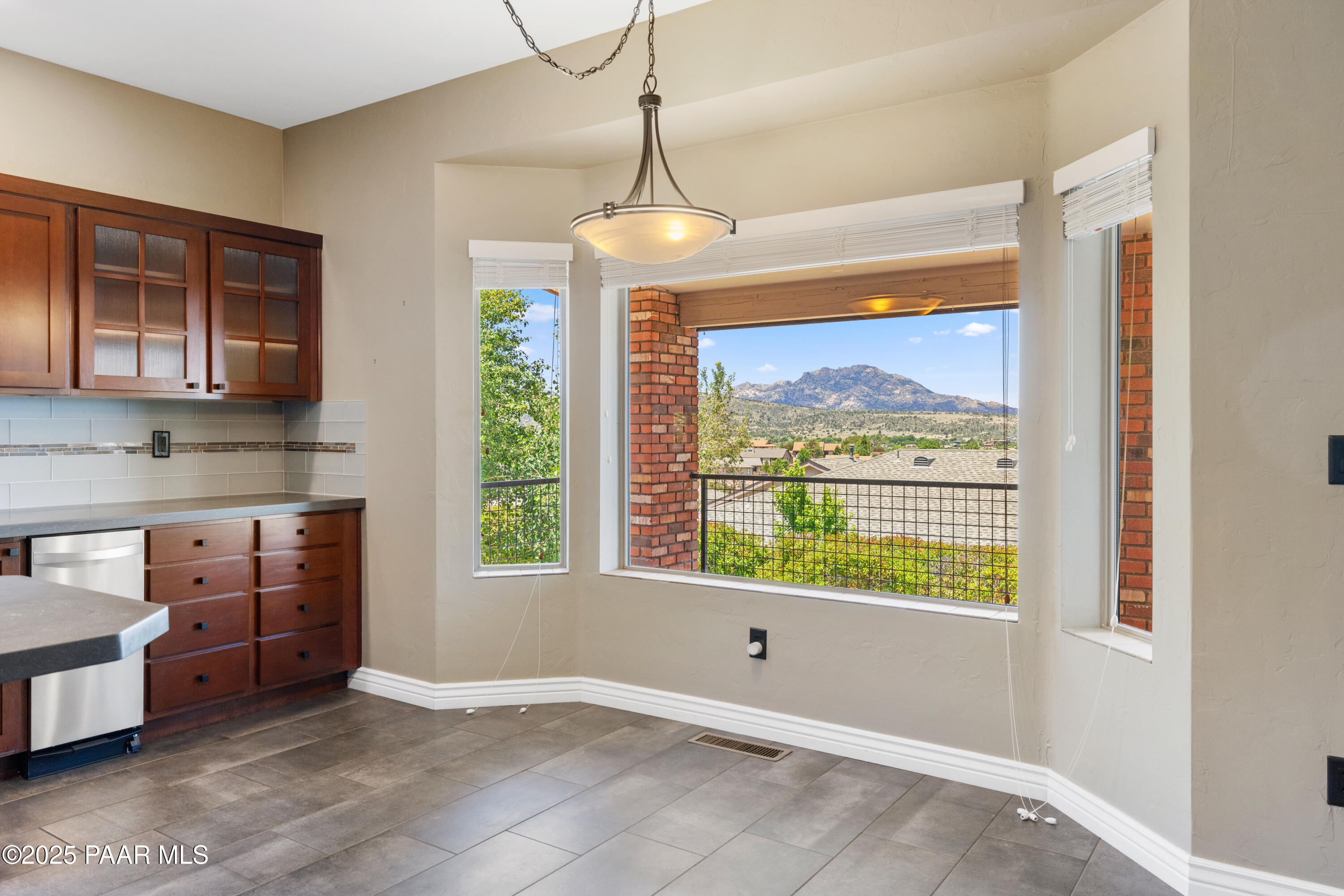 830 Hoosier Pass Prescott, AZ 86301 - Photo 22 of 41 a view of an empty room with a window and kitchen view