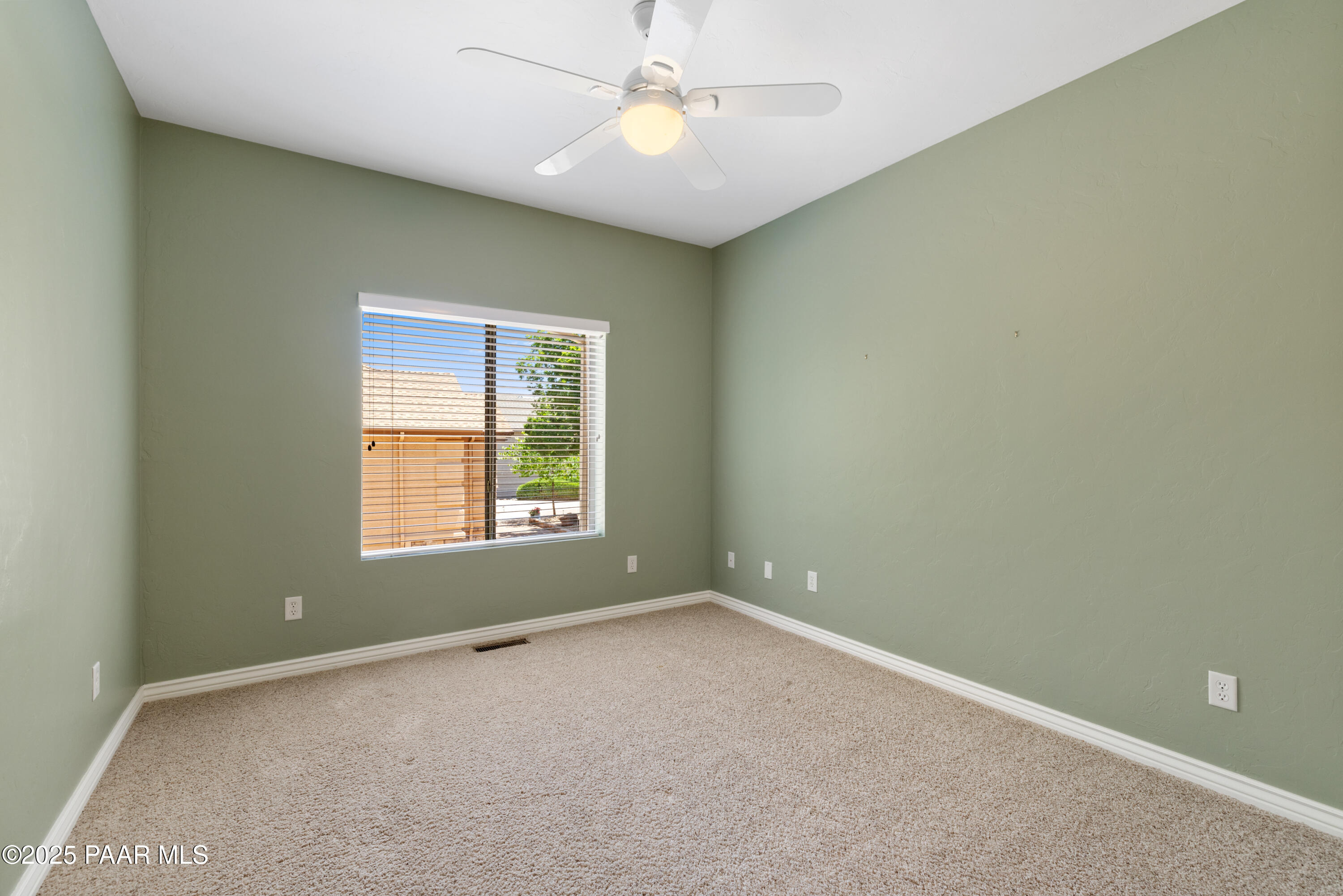 830 Hoosier Pass Prescott, AZ 86301 - Photo 29 of 41 an empty room with a window and a fan