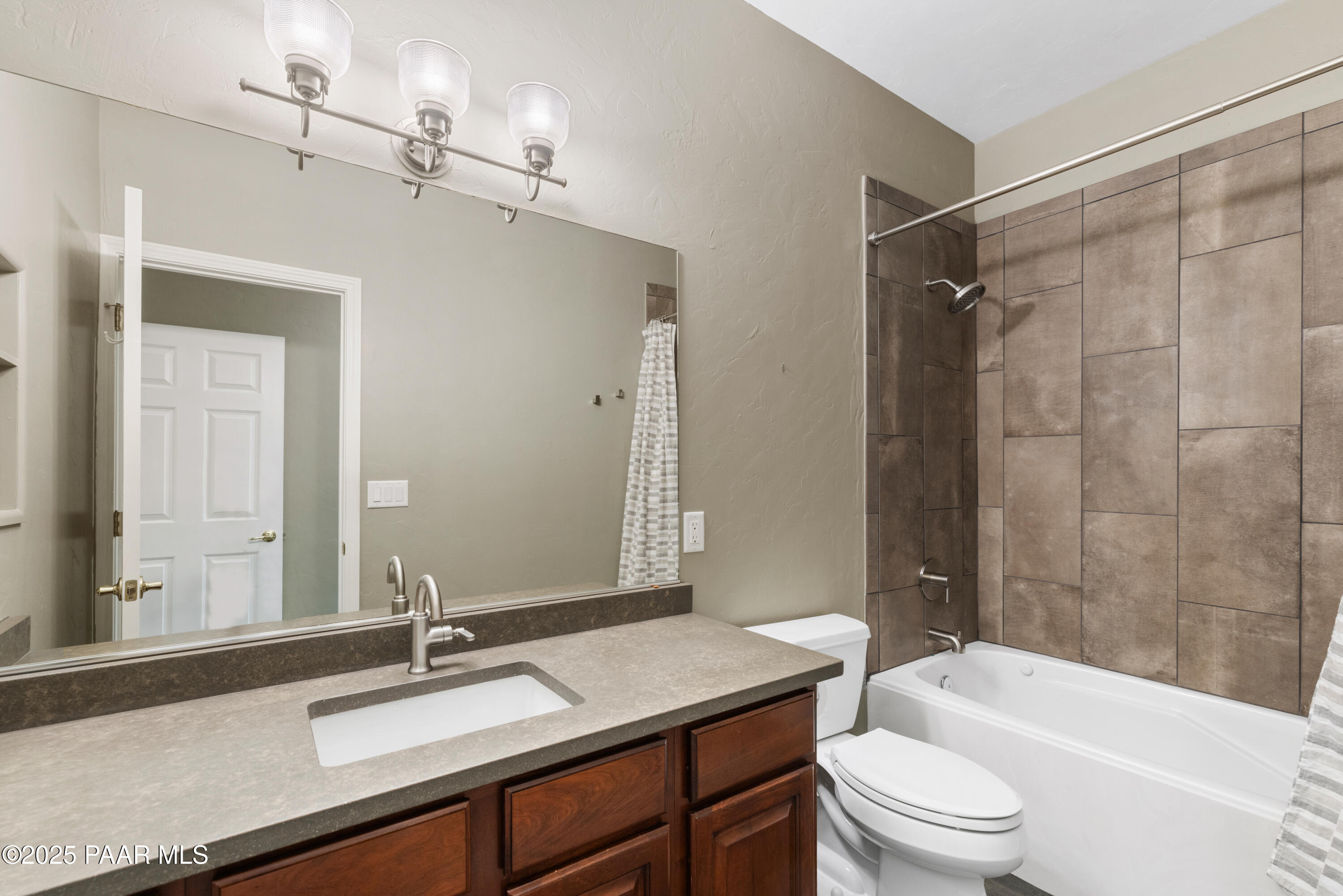 830 Hoosier Pass Prescott, AZ 86301 - Photo 30 of 41 a bathroom with a sink a toilet a mirror and shower