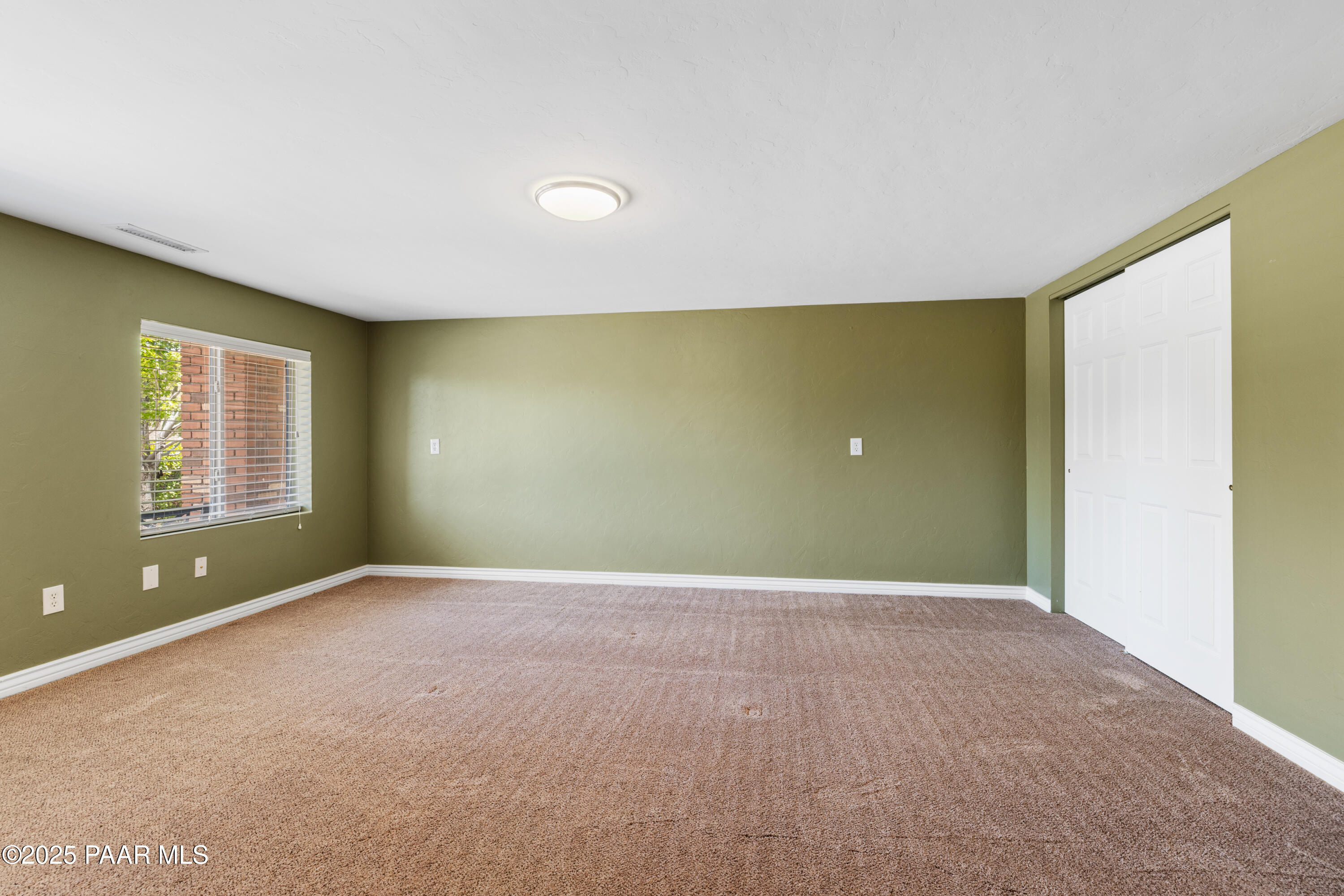 830 Hoosier Pass Prescott, AZ 86301 - Photo 31 of 41 a view of an empty room with window and stairs