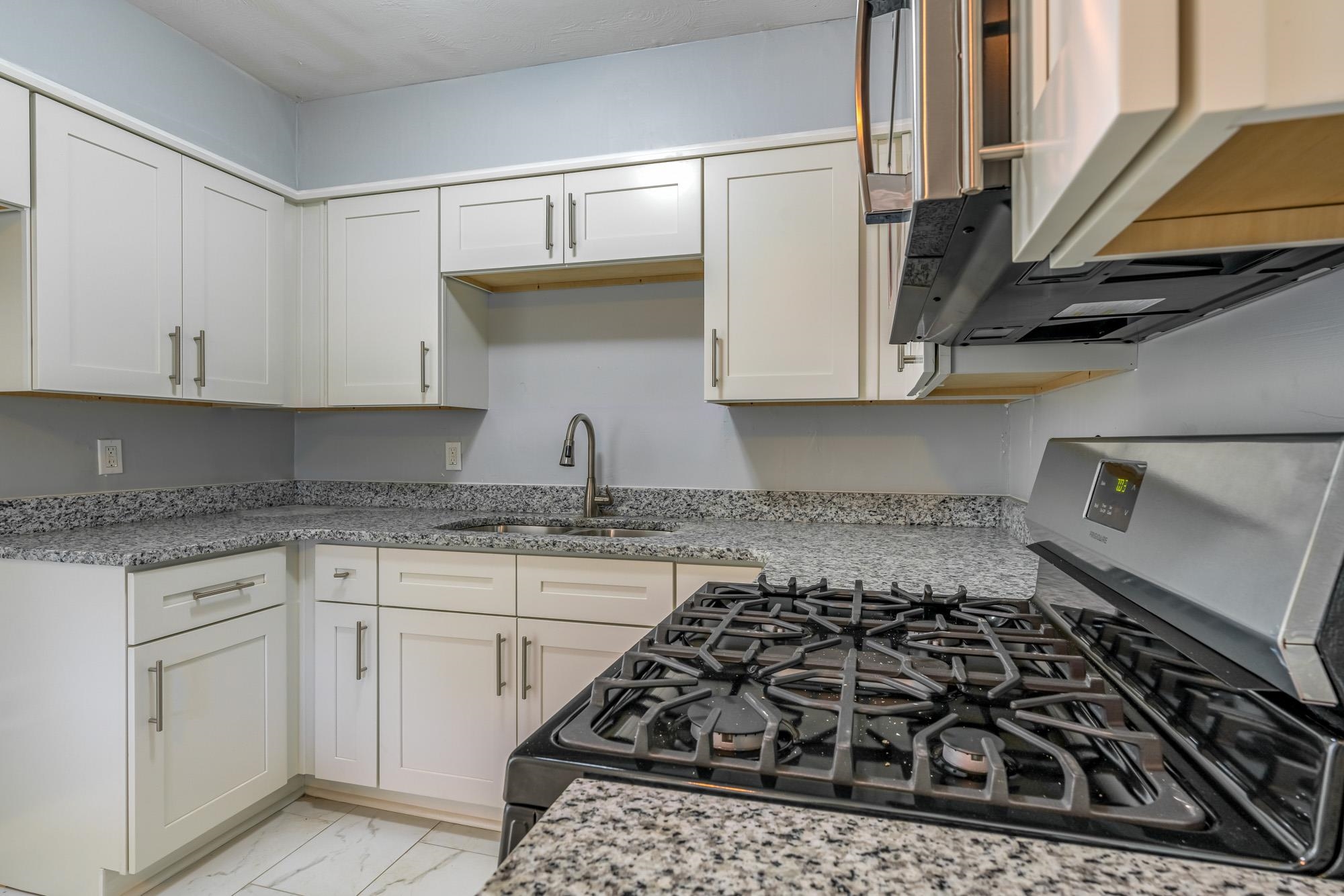 4606 Tulane Road Memphis, TN 38109 - Photo 14 of 25 a kitchen with sink and cabinets