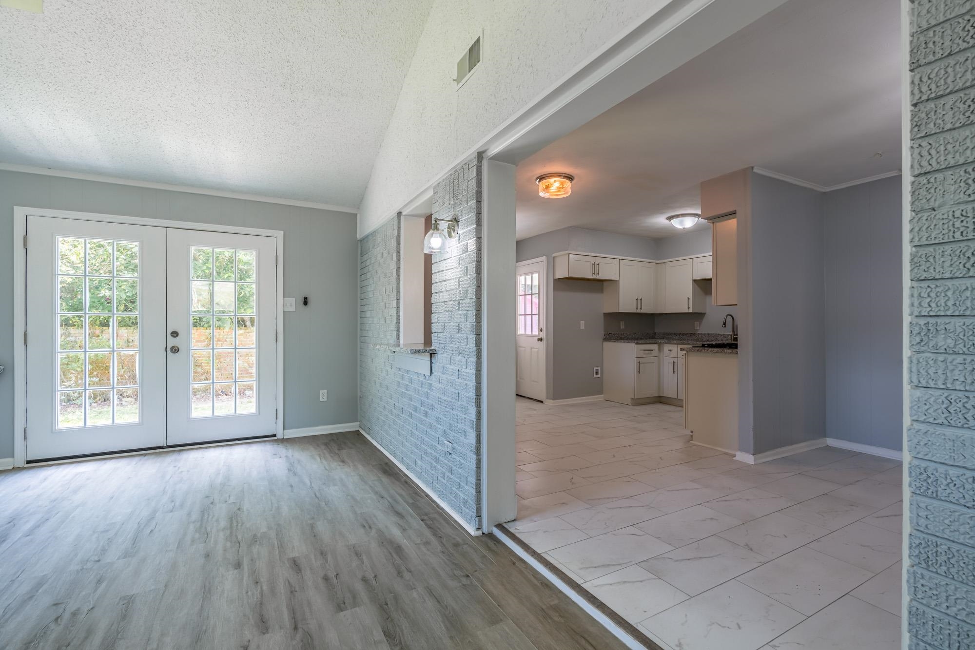 4606 Tulane Road Memphis, TN 38109 - Photo 19 of 25 a view of a kitchen with wooden floor and a kitchen