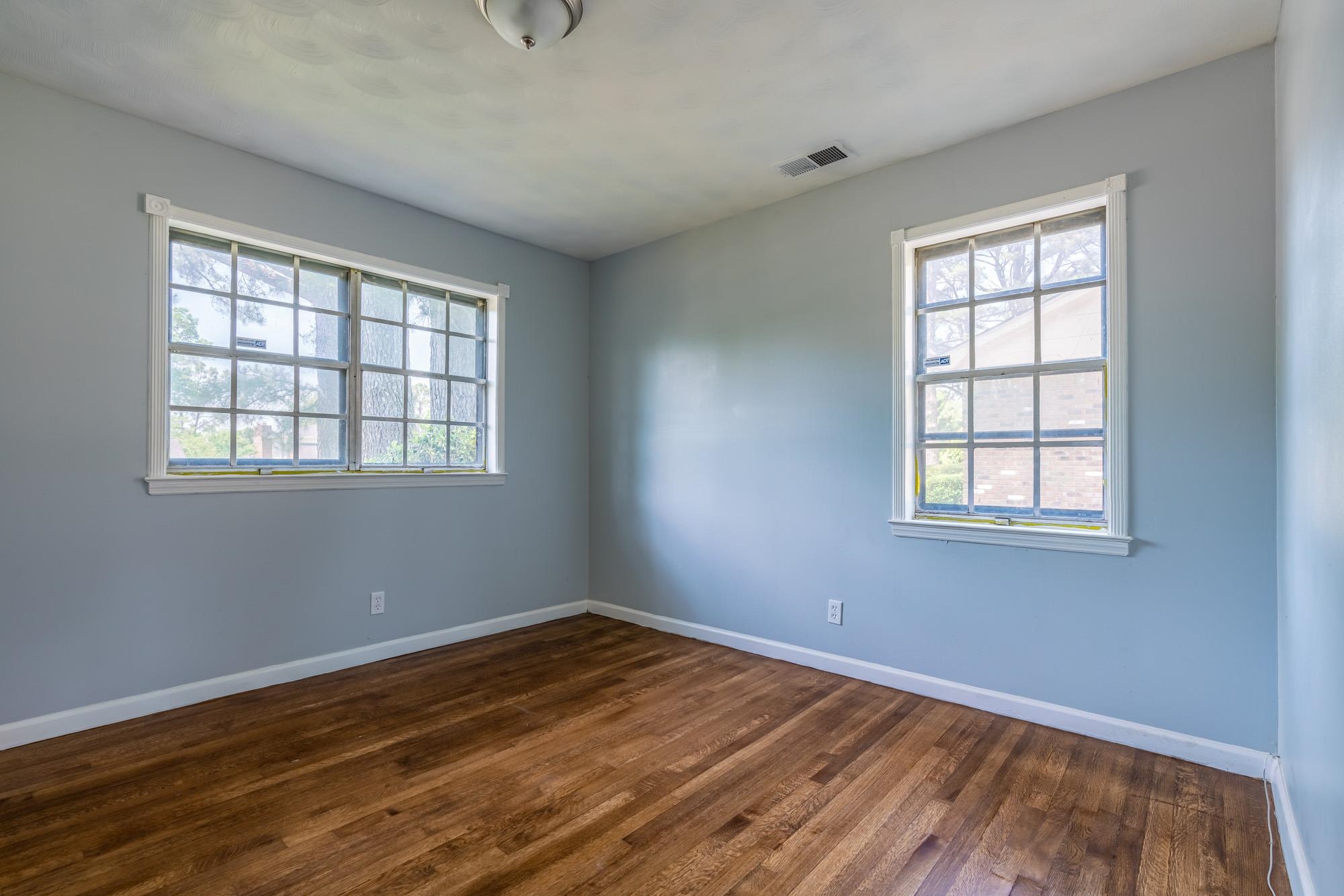 4606 Tulane Road Memphis, TN 38109 - Photo 23 of 25 a view of empty room with wooden floor and fan