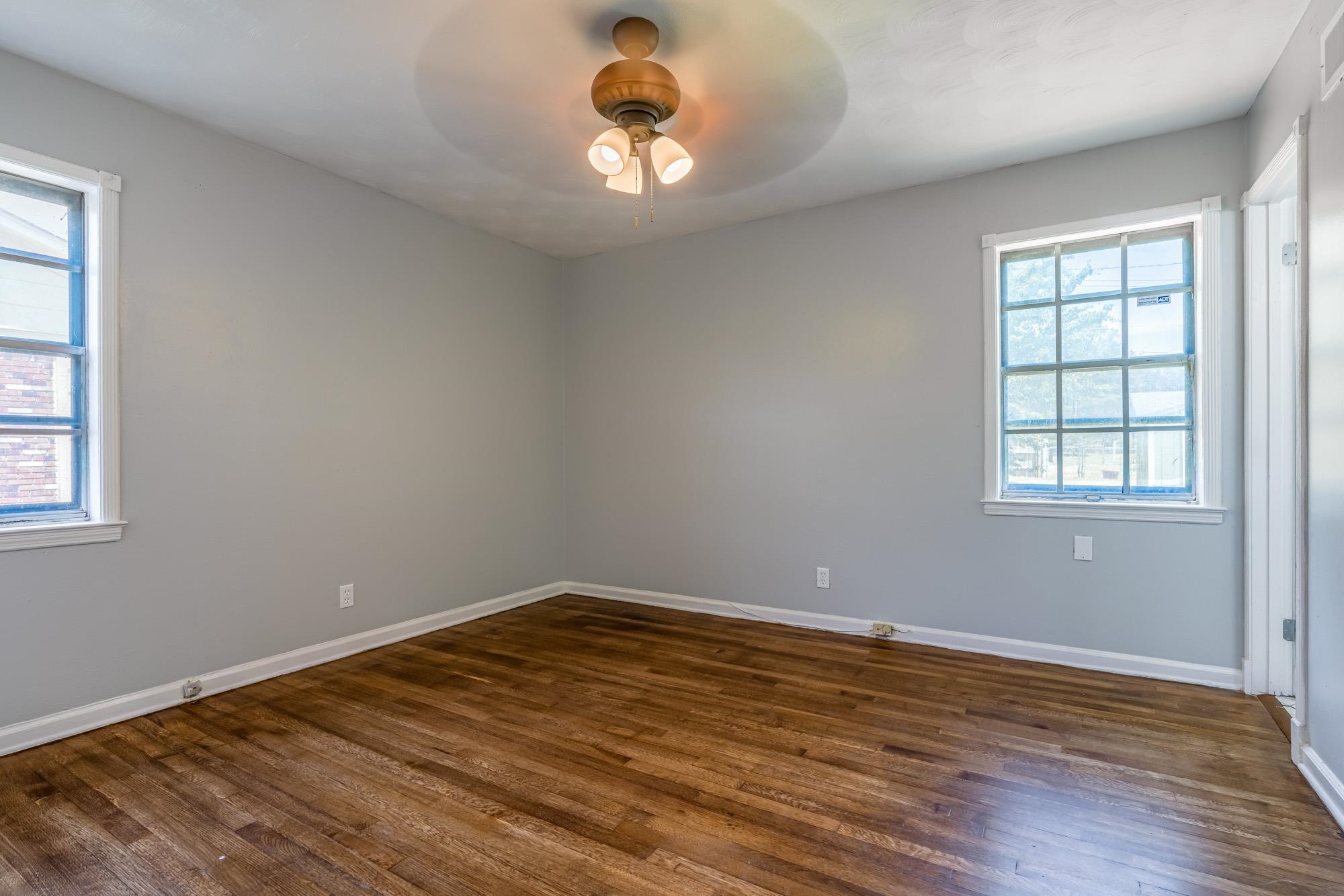 4606 Tulane Road Memphis, TN 38109 - Photo 24 of 25 a view of empty room with wooden floor and fan