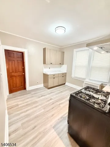 a kitchen with stainless steel appliances granite countertop a stove and a refrigerator