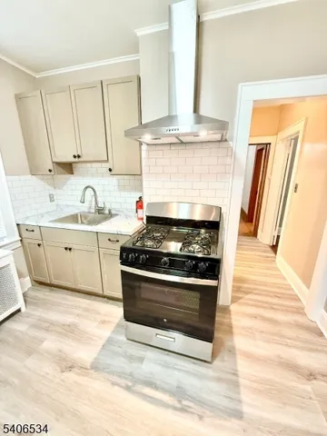 a kitchen with stainless steel appliances granite countertop a stove and a sink