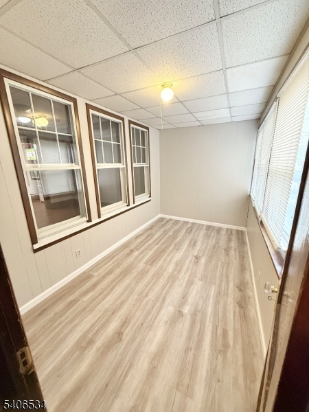 727 Pennington Street Elizabeth, NJ 07202 - Photo 3 of 18 a view of an empty room with wooden floor and a window