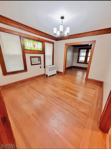 727 Pennington Street Elizabeth, NJ 07202 - Photo 8 of 18 a view of an empty room with window and wooden floor