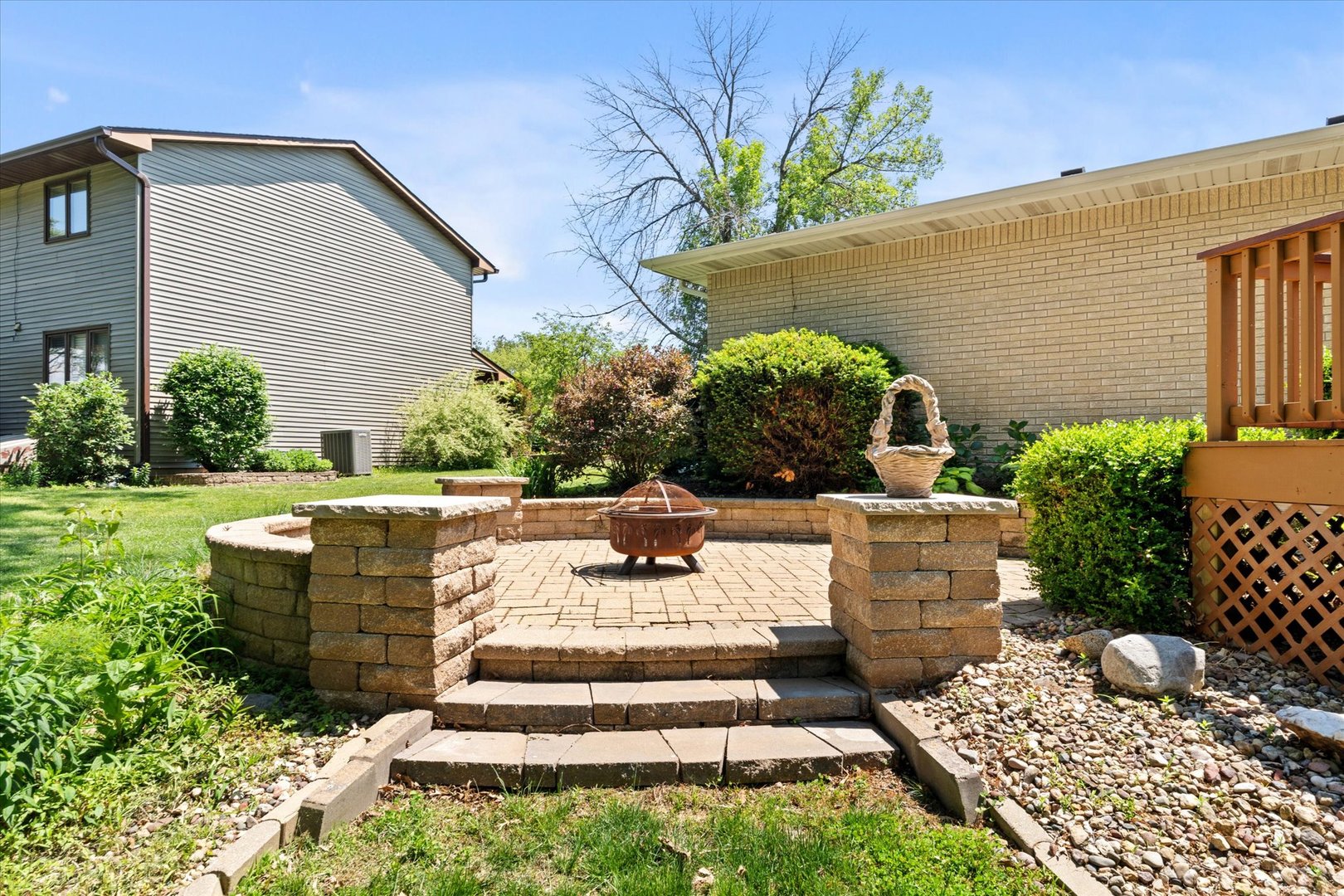 10 Oak Grove Road Geneseo, IL 61254 - Photo 37 of 43 a view of a patio with table and chairs potted plants and large tree
