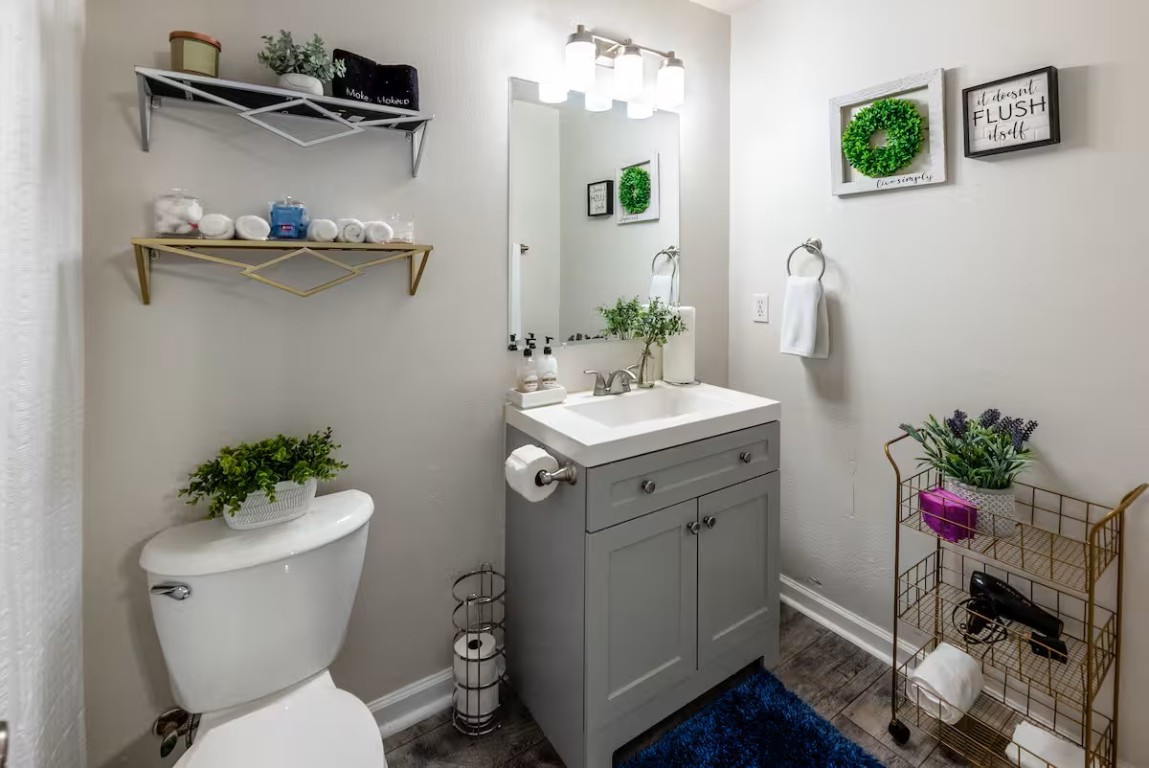 2304 Smith Branch Boulevard, Unit A Georgetown, TX 78626 - Photo 17 of 26 a bathroom with a sink mirror and toilet