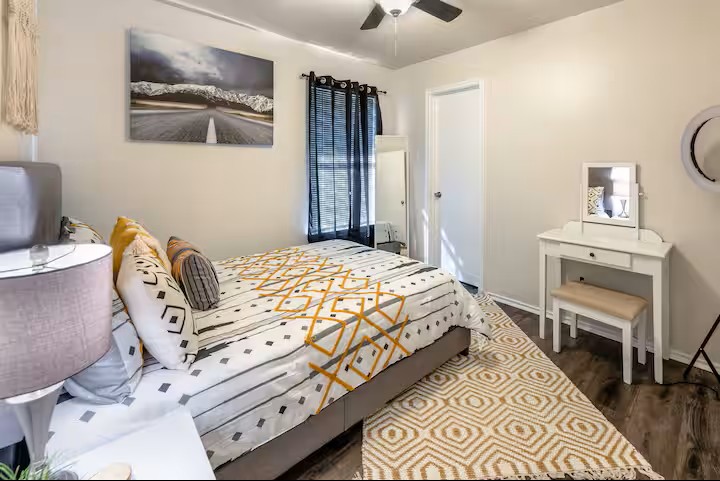 2304 Smith Branch Boulevard, Unit A Georgetown, TX 78626 - Photo 22 of 26 a bedroom with a bed and a chair