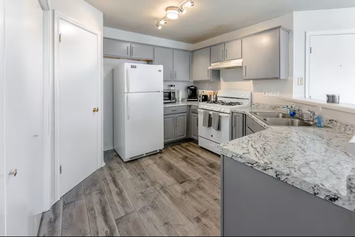 2304 Smith Branch Boulevard, Unit A Georgetown, TX 78626 - Photo 10 of 26 a kitchen with a refrigerator sink and cabinets