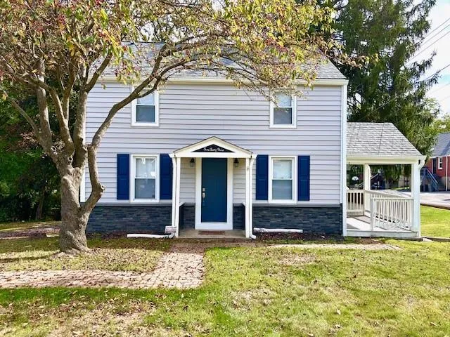 a front view of a house with a yard