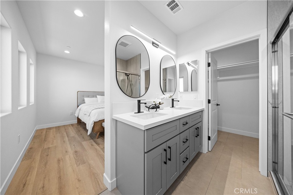 7692 9th Street, Unit 113 Buena Park, CA 90621 - Photo 19 of 41 a bathroom with a sink and a mirror
