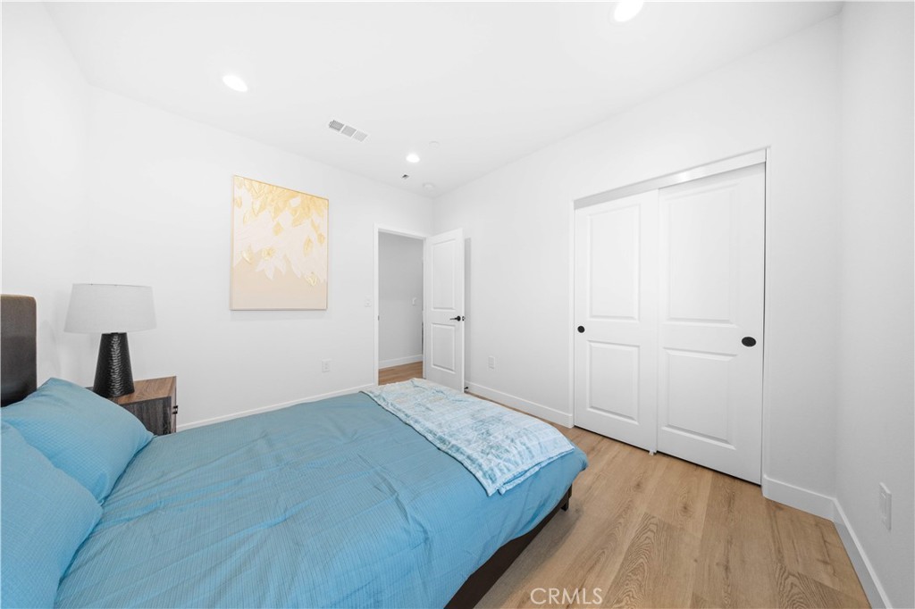 7692 9th Street, Unit 113 Buena Park, CA 90621 - Photo 23 of 41 a bedroom with a bed and a window