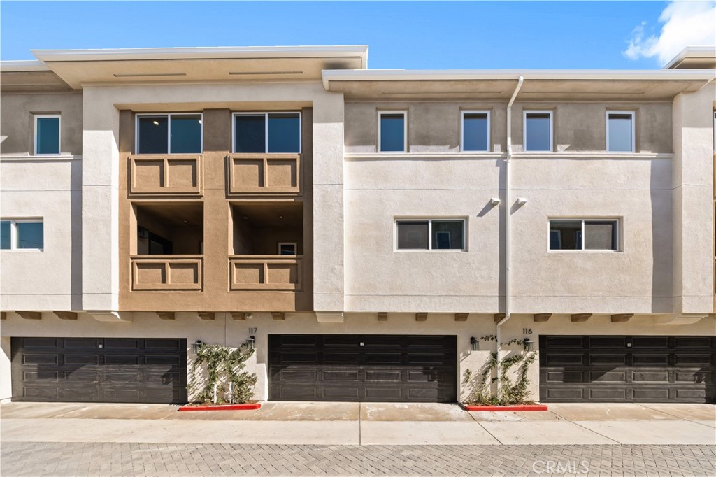 7692 9th Street, Unit 113 Buena Park, CA 90621 - Photo 35 of 41 a front view of a house with windows