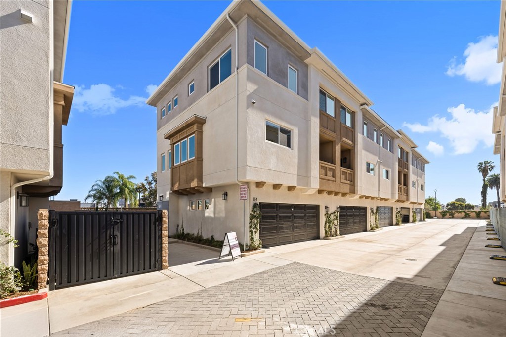 7692 9th Street, Unit 113 Buena Park, CA 90621 - Photo 36 of 41 a front view of a building with street