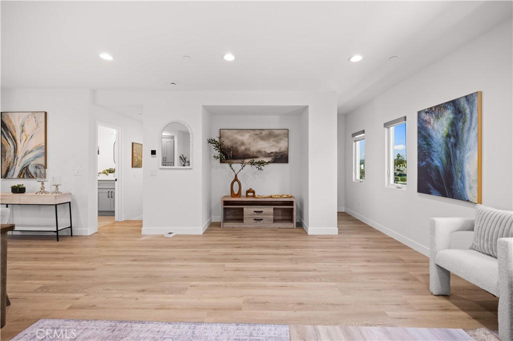 7692 9th Street, Unit 113 Buena Park, CA 90621 - Photo 9 of 41 a living room with furniture and a wooden floor