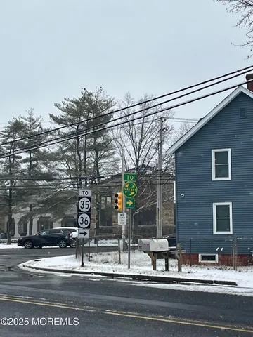 a front view of a house with parking space