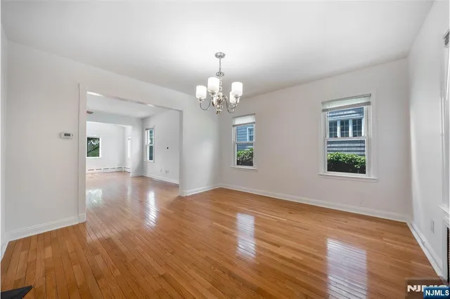 a view of livingroom with window and wooden floor