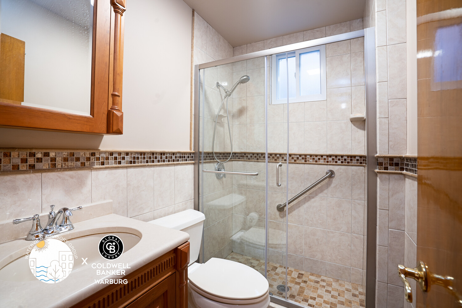 71-20 68th Street, Unit 2 Queens, NY 11385 - Photo 6 of 9 a bathroom with a sink a toilet and a shower