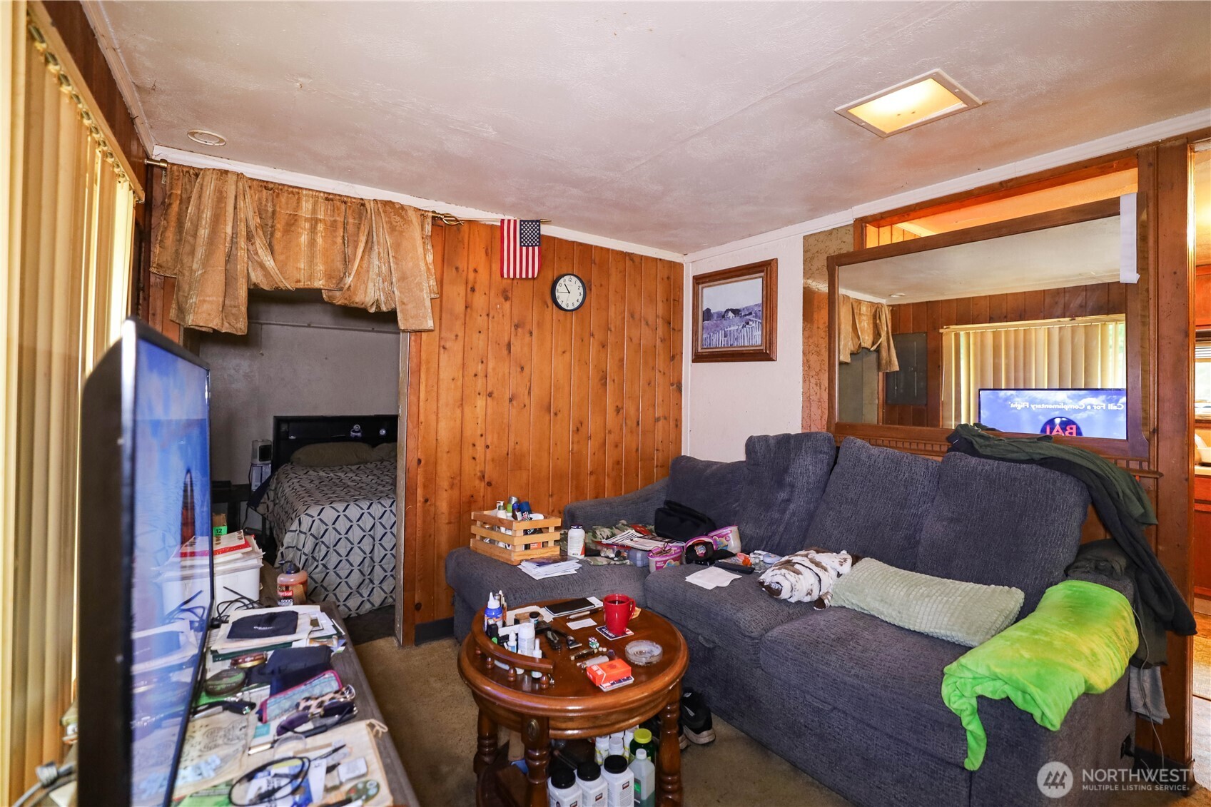 6703 Karjala Road Aberdeen, WA 98520 - Photo 3 of 15 a living room with furniture and a table