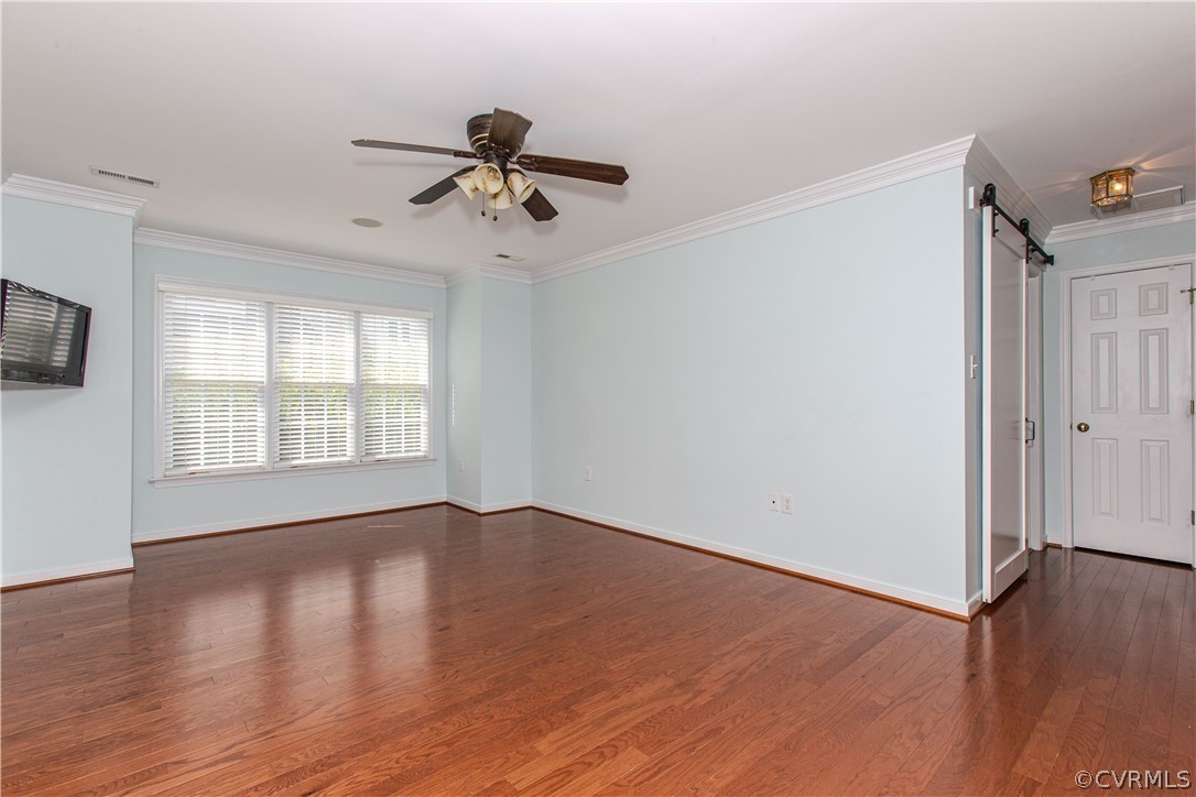 5056 Park Commons Loop Glen Allen, VA 23059 - Photo 13 of 29 a view of empty room with wooden floor and fan