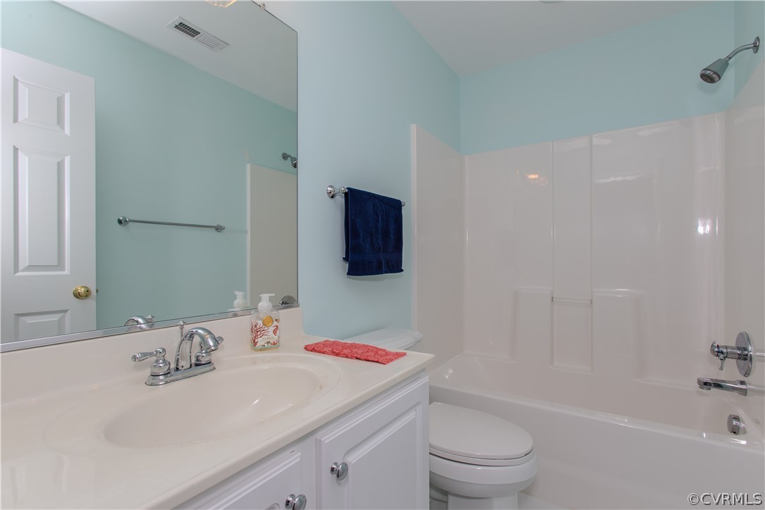 5056 Park Commons Loop Glen Allen, VA 23059 - Photo 19 of 29 a bathroom with a sink a toilet and a bathtub