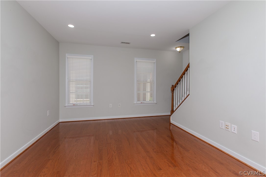 5056 Park Commons Loop Glen Allen, VA 23059 - Photo 23 of 29 wooden floor in an empty room with a window