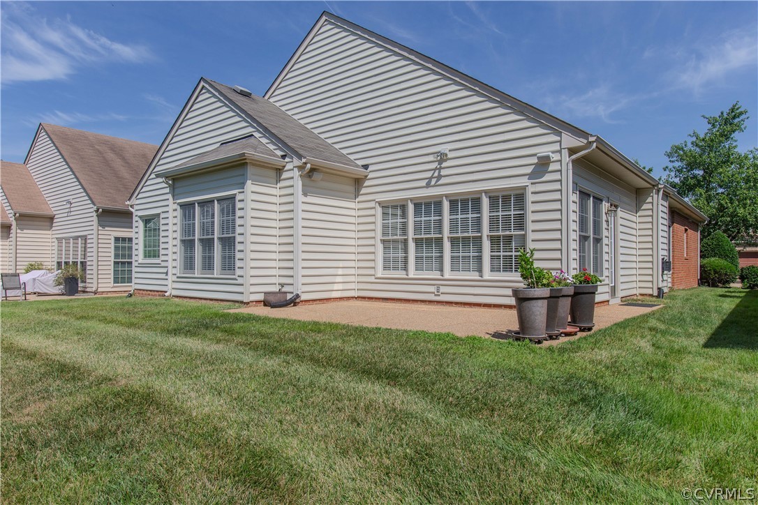 5056 Park Commons Loop Glen Allen, VA 23059 - Photo 27 of 29 a front view of a house with a garden