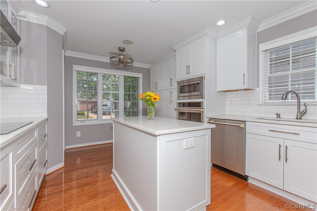 5056 Park Commons Loop Glen Allen, VA 23059 - Photo 8 of 29 a kitchen with a stove a sink and a refrigerator