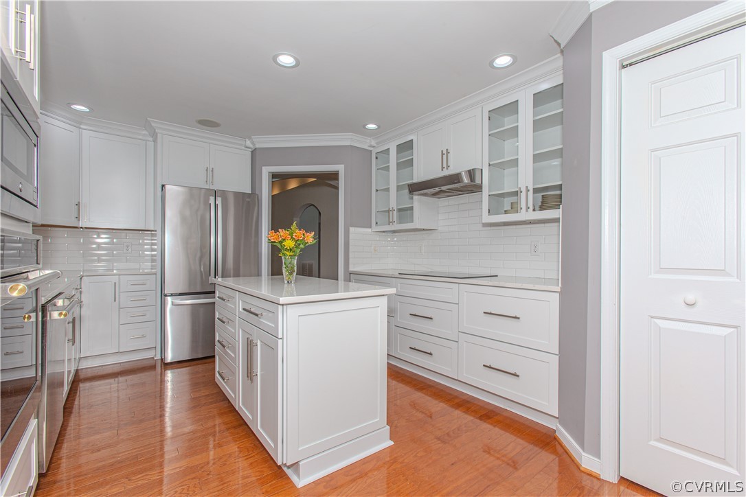 5056 Park Commons Loop Glen Allen, VA 23059 - Photo 10 of 29 a kitchen with white cabinets and stainless steel appliances