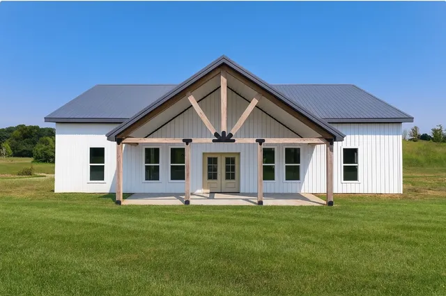 a front view of house with yard and green space