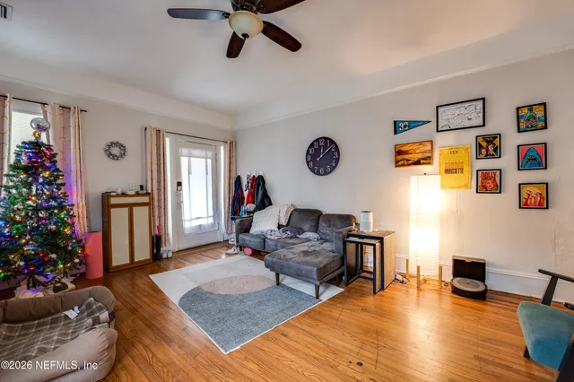 a living room with furniture and a flat screen tv
