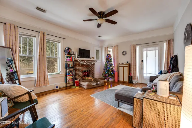 a bed sitting in a room next to a window