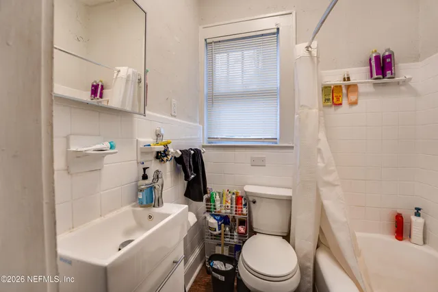 a bathroom with a sink and toilet