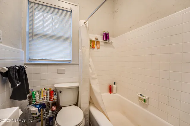 a kitchen with sink refrigerator and cabinets
